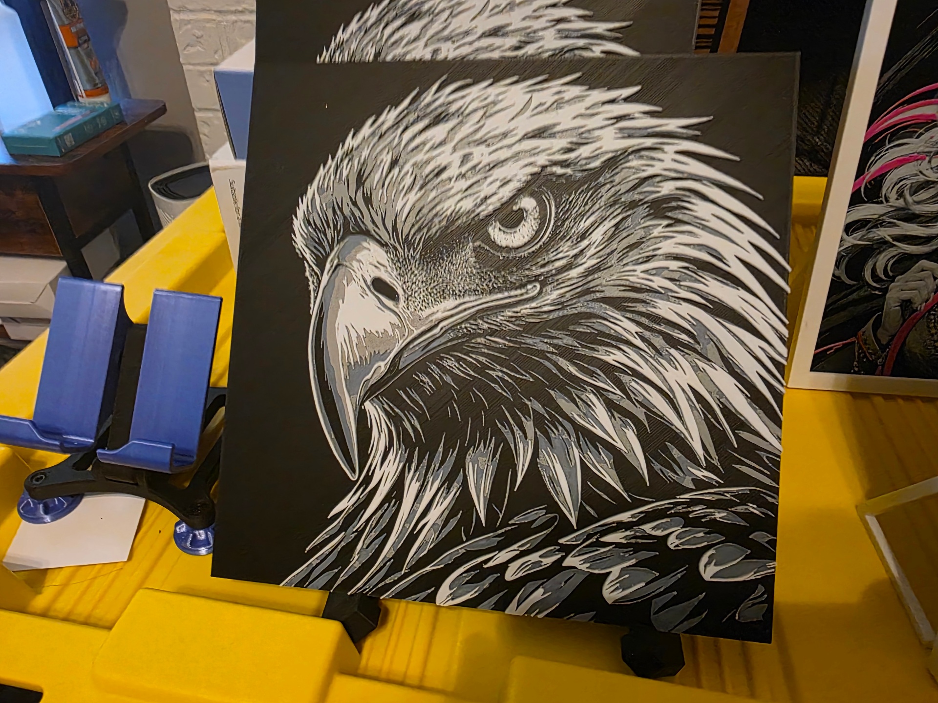 Layered eagle head panel printed in grey, white, and black